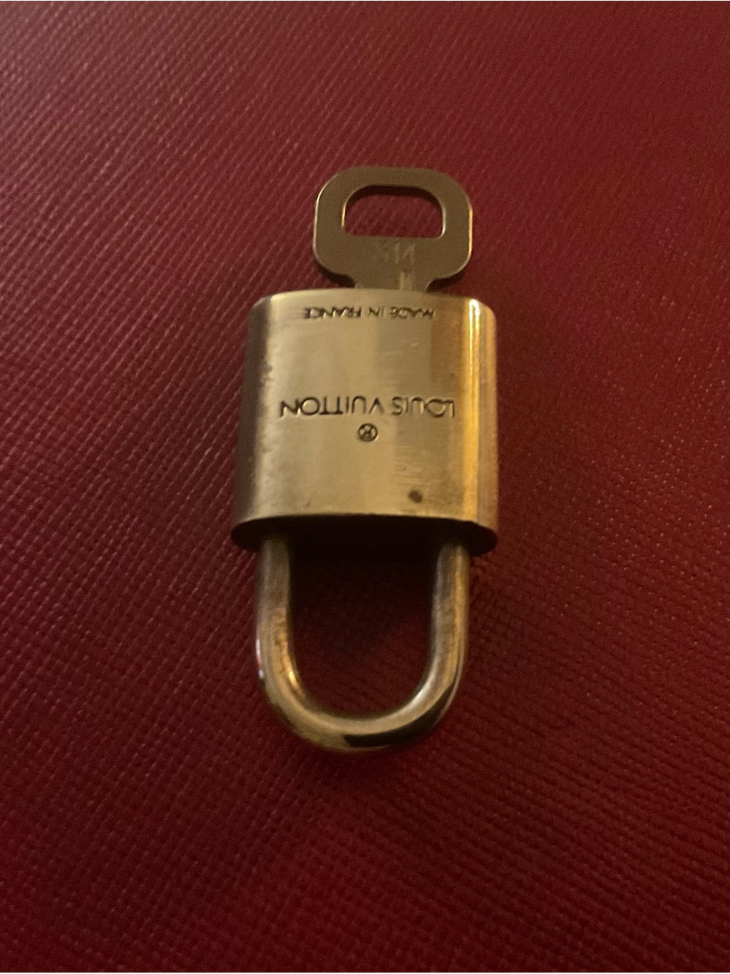 Louis Vuitton brass padlock