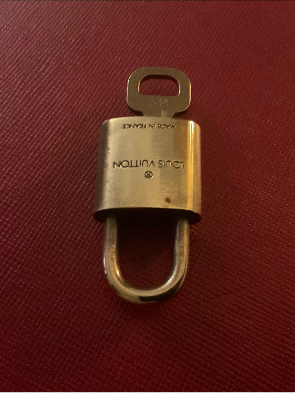 Louis Vuitton brass padlock